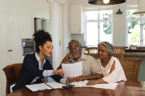 A loan officer explaining how a reverse mortgage line of credit works